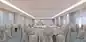 Elegant banquet room with white tablecloths and matching chairs, ideal luxury event space.